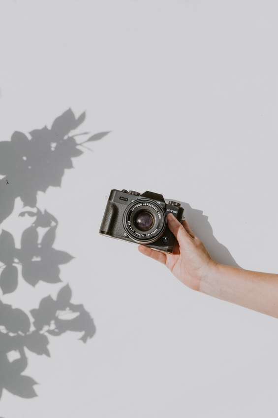 Person Holding Black Dslr Camera